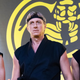 Johnny Lawrence (Billy Zabka, center) is flanked by his star pupils Hawk (Jacob Bertrand, left) and Miguel (Xolo Maridueña, right) in Cobra Kai season two.